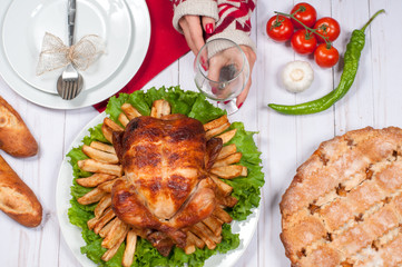 Homemade  roasted whole turkey on wooden table for Thanksgiving.