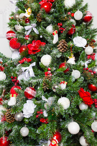 Beautiful Christmas Tree Decorated With Red And White Balls Cones