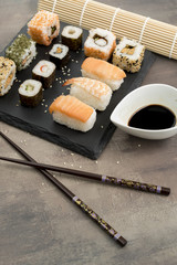 Set of sushi and chopsticks, traditional asian dishes.