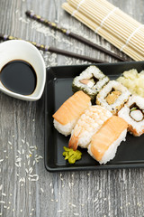 Set of sushi and chopsticks, traditional asian dishes.