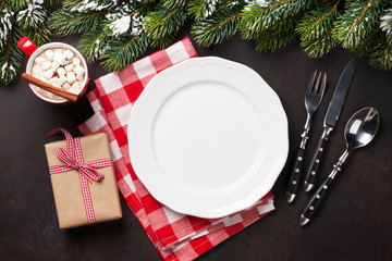 Christmas dinner plate, silverware, fir tree, gift