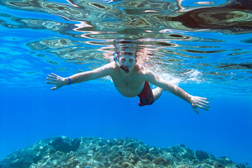 Fototapeta premium Man snorkeling in Red Sea of Egypt
