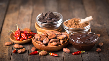 Cocoa beans and dark chocolate with chili peppers