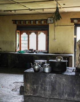 Tinned copper kitchen utensils in an empty kitchen of a building in Bhutan, Asia