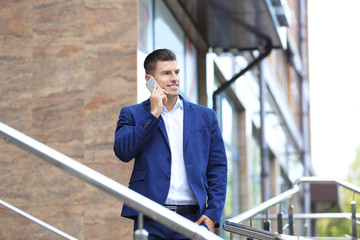 Attractive man in formal suit on city street