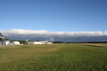 skydiver`s landing before cloud front