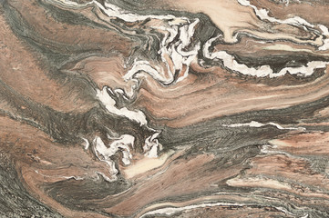 brown white wave patterns in marble