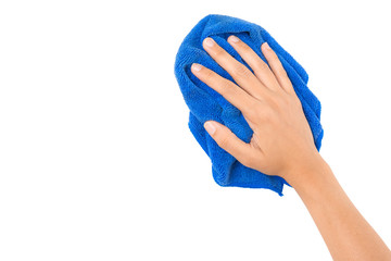 Hand and blue rag cleaning wall