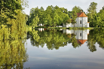 Fototapeta na wymiar Church of St. John of Nepomuk on water in Zwierzyniec. Poland