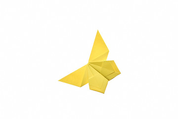 Yellow butterfly origami ornament, isolated on white. Beautiful result of folding paper. Cute and...