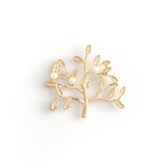 brooch golden tree with pearls isolated on a white background