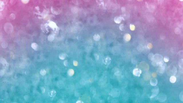 Abstract sparkles or glitter lights. Defocused circles bokeh or particles , light blue and pink tone