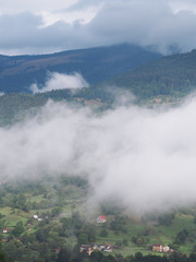 Fog at the village in the carpatian mountains