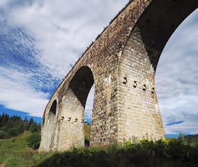 old austrian bridge at the Karpatian mountains view from down