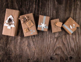 Boxes of gifts in natural paper rustic wooden table