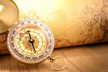 Fototapeta na wymiar Old vintage compass with vintage map