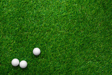 Golf balls on green grass in golf course