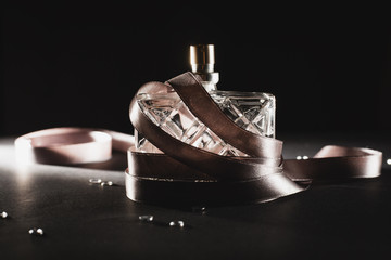 Female perfume over dark background