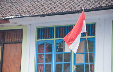 Red and White Indonesian flag on a home