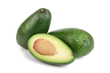 whole and half avocado isolated on white background close-up. Top view