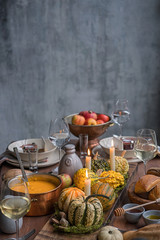 Autumn table setting with pumpkins. Thanksgiving dinner and fall decoration.