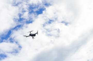 Fototapeta na wymiar The drone in the clouds