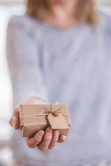 Woman showing beautiful craft gift box