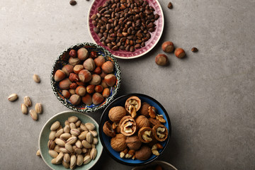 Assorted nuts on concrete background