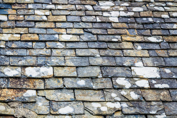 Background of old stone roof tiles