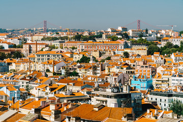 Naklejka premium Aerial View Of Downtown Lisbon Skyline Of The Old Historical City And 25 de Abril Bridge (25th April Bridge) In Portugal