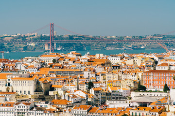 Aerial View Of Downtown Lisbon Skyline Of The Old Historical City And 25 de Abril Bridge (25th April Bridge) In Portugal