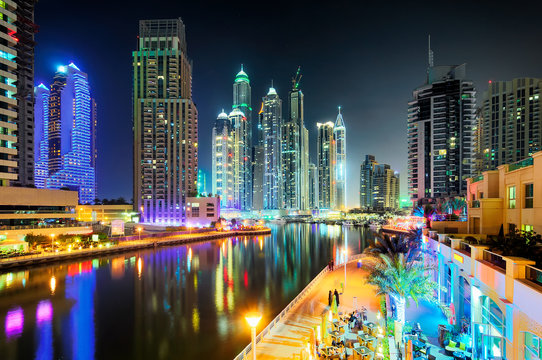 Dubai skyline during night. Dubai marina promenade, United Arab Emirates.