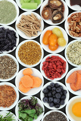 Berry fruit, vegetables, fish, nuts, seeds and herbs for brain boosting super foods. Healthy food concept, foods high in omega 3, vitamins, minerals, antioxidants and anthocyanins. Top view.