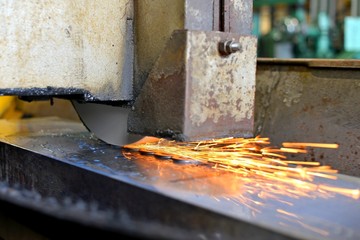 metalworking industry: finishing metal working on horizontal surface grinder machine with flying sparks