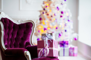 Christmas background. Interior room decorated in xmas style. No people. New year tree and gifts