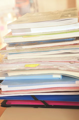 Fototapeta premium Pile of books and papers in the classroom