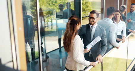 Picture of young attractive business partners standing