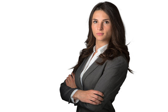 Serious And Confident Strong Business Woman Posing With Arms Folded Against White Background