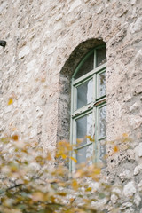 vintage window on old brick building 