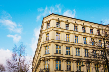 Fototapeta na wymiar beautiful corner building at friedrichshain with colorful sky