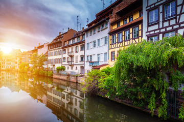 Fototapeta na wymiar Beautiful view of the historic town of Strasbourg, colorful houses on idyllic river. Strasbourg, France