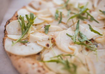 pieces of pizza with a pear close up and blurry