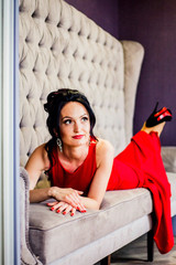 Fototapeta premium Sexy woman posing in red dress