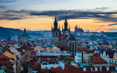 Obraz premium Aerial view over Church of Our Lady before Tyn, Old Town and Prague Castle at sunset in Prague, Czech Republic