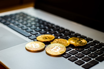 Golden bitcoin on keyboard