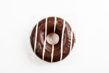 Chocolate donut on a white background, top view
