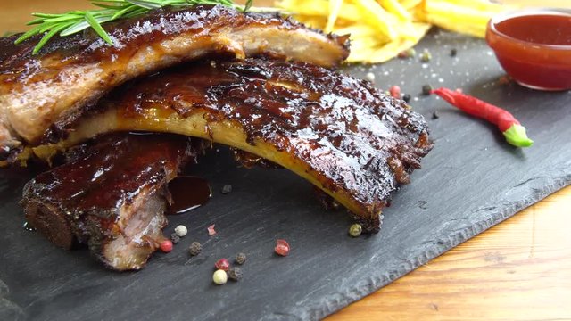 grilled bbq ribs on stone plate