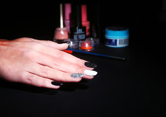 Black, white Nail art manicure. Holiday style bright Manicure with sparkles. Beauty hands. Stylish Nails, Nail Polish