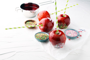 Sugar apple with red icing. Sweets paradise apple from market in Germany. Sweet candy Apple