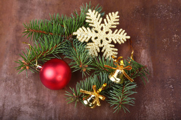 Christmas decoration with Beautiful colorful balls, christmas tree and fir cones on wooden background.